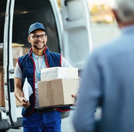 happy-deliverer-carrying-packages-while-making-home-delivery-his-customer (2)